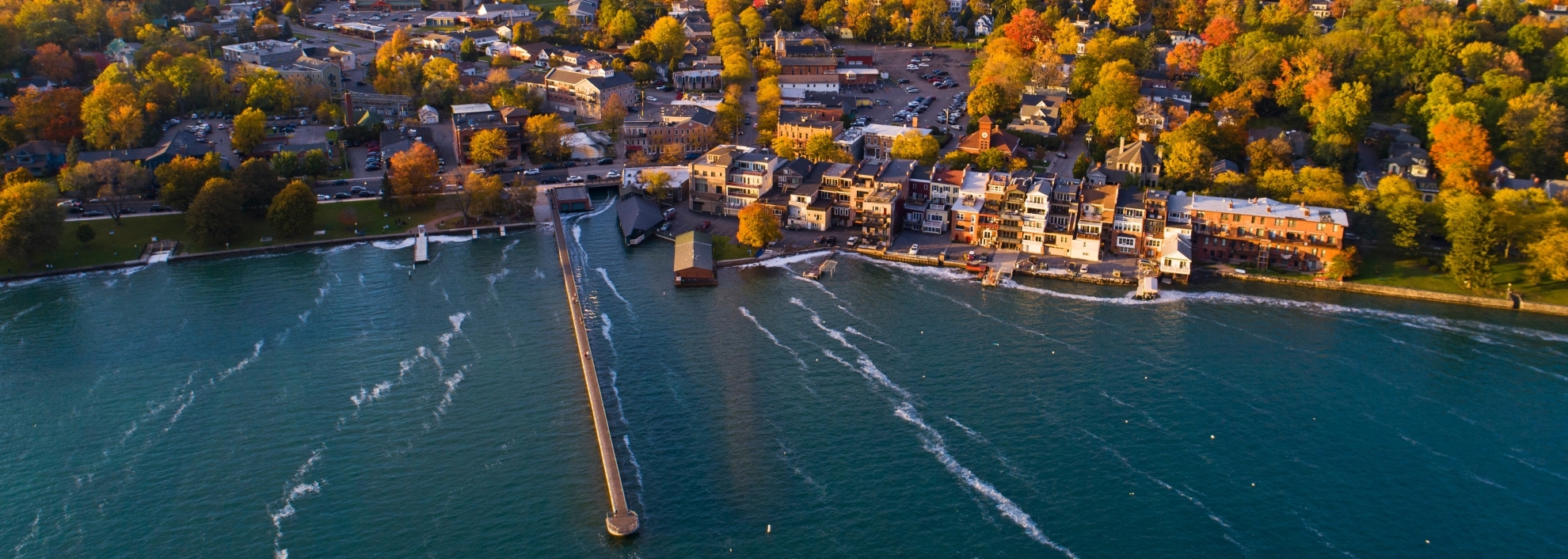 Aerial of Small Village on Lakeshore in Autumn
